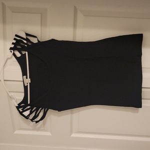 Black top with strappy shoulders.